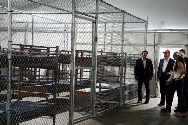President Donald Trump tours "Alligator Alcatraz," a new migrant detention facility at Dade-Collier Training and Transition facility, Tuesday, July 1, 2025, in Ochopee, Fla. (AP Photo/Evan Vucci)