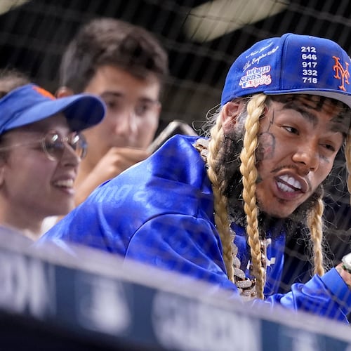 FILE - Rapper Tekashi 6ix9ine watches a baseball game between the Miami Marlins and New York Mets, Aug. 3, 2021, in Miami. (AP Photo/Lynne Sladky, File)