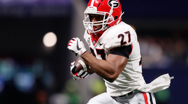 ATLANTA, GA - DECEMBER 02: Nick Chubb #27 of the Georgia Bulldogs runs the ball during the first half against the Auburn Tigers in the SEC Championship at Mercedes-Benz Stadium on December 2, 2017 in Atlanta, Georgia. (Photo by Jamie Squire/Getty Images)