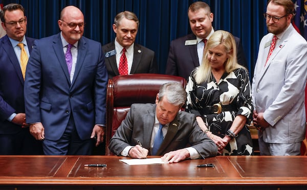 Gov. Brian Kemp signs the ‘religious liberty’ bill on the last day of the legislative session at the Georgia State Capitol, April 4, 2025. (Natrice Miller/ AJC)