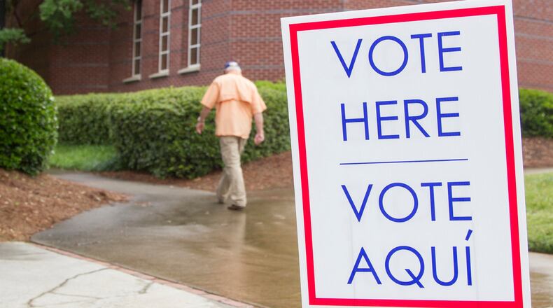 Gwinnett County residents take part in the primary election voting at Duluth Festival Center in Duluth, Georgia, on Tuesday, May 22, 2018. (REANN HUBER/REANN.HUBER@AJC.COM)