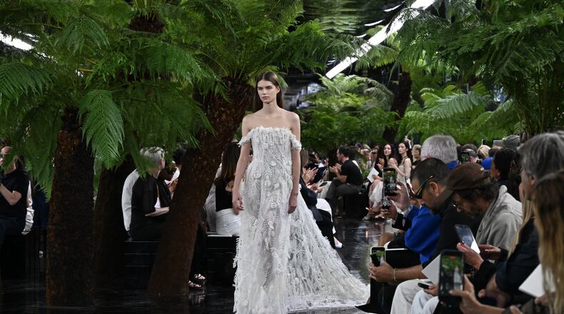 A model wears a creation as part of the Christian Dior Haute Couture Fall/Winter 2026-2027 Women's collection presented in Paris, Monday, July 6, 2026. (AP Photo/Emma Da Silva)