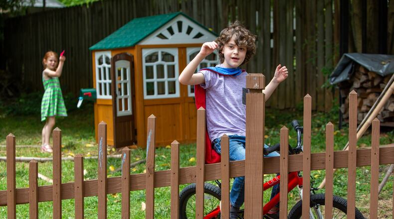 Eight-year-old Everett Gray (right) plays with his sister Eila at their Atlanta home. Everett received a heart transplant at age 3. The nonprofit Enduring Hearts has raised $5 million for research into extending the life of children who have received heart transplants. PHIL SKINNER FOR THE ATLANTA JOURNAL-CONSTITUTION