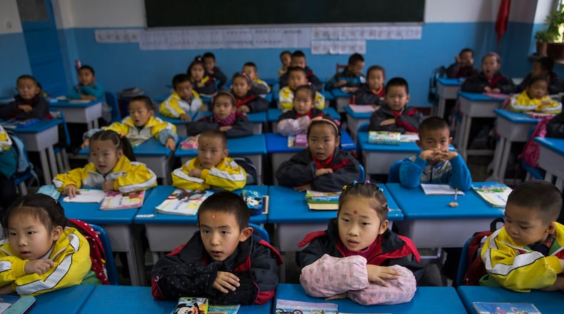 Can we learn anything from East Asian cultures where teachers are revered and parents highly involved in their child's learning? (Adam Dean/The New York Times)