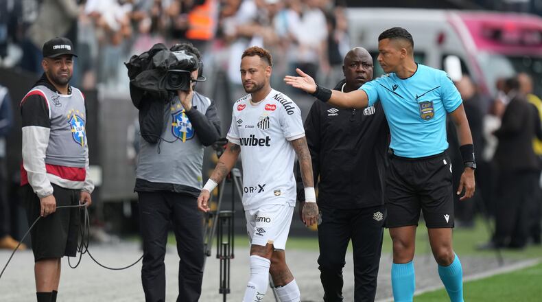 Santos' Neymar leaves the field after being substituted during a Brazilian Championship soccer match against Coritiba in Sao Paulo, Sunday, May 17, 2026. (AP Photo/Andre Penner)
