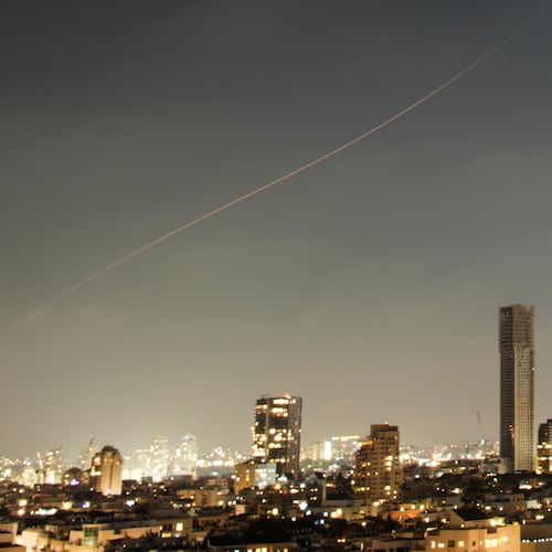 A projectile streaks through the sky over central Israel during an Iranian missile attack, Sunday, June 7, 2026. (AP Photo/Ohad Zwigenberg)