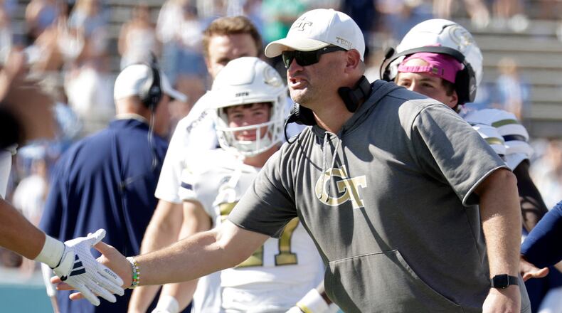 Georgia Tech head coach Brent Key congratulates the players after they scored against North Carolina during the second half of an NCAA college football game, Saturday, Oct. 12, 2024, in Chapel Hill, N.C. (AP Photo/Chris Seward)