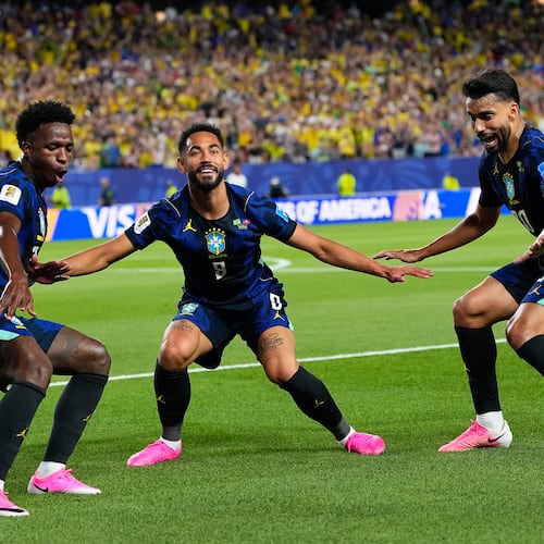 Brazil's Matheus Cunha (9) celebrates after scoring his side's second goal with Brazil's Vinicius Junior (7) and Lucas Paqueta (20) during the World Cup Group C soccer match between Brazil and Haiti in Philadelphia, Friday, June 19, 2026. (AP Photo/Petr David Josek)