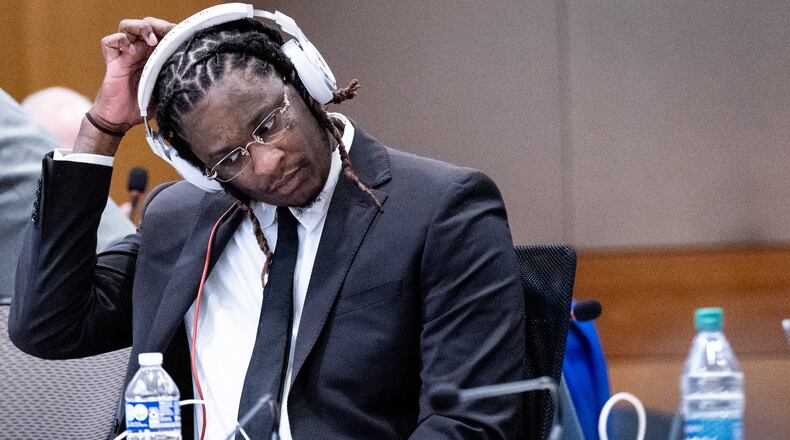 Atlanta rapper Young Thug, whose real name is Jeffery Williams, waits for the start of opening statements of his trial at Fulton County Courthouse Monday, Nov. 27, 2023.   (Steve Schaefer/steve.schaefer@ajc.com)