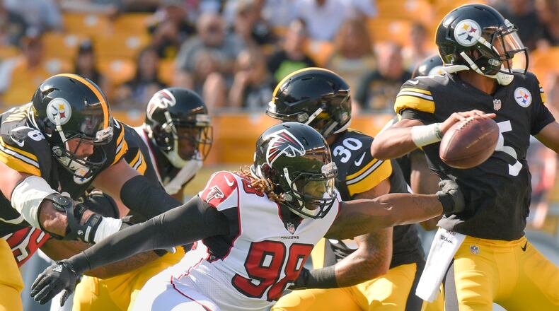 Atlanta Falcons defensive end Takkarist McKinley (98) reaches for Pittsburgh Steelers quarterback Joshua Dobbs (5) in their exhibition game, Sunday, Aug. 20, 2017, in Pittsburgh. (AP Photo/Don Wright)
