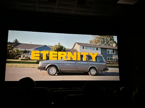 Springs Cinema & Taphouse in Sandy Springs held its first Mystery Movie Night on Nov. 10, 2025. What popped up was the fantasy romantic comedy film "Eternity" starring Miles Teller and Elizabeth Olsen that will be released widely in theaters Nov. 28. (Rodney Ho/AJC) 