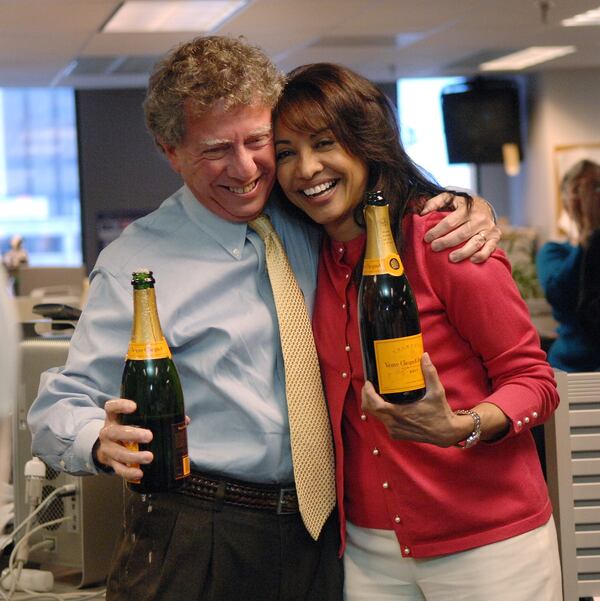 Atlanta Journal and Constitution Editorial Page Editor Cynthia Tucker (right), winner of the 2007 Pulitzer Prize for editorial writing, and AJC Managing Editor Hank Klibanoff, winner of the 2007 Pulitzer history book category, celebrate the occasion on April 15, 2007, in the paper's downtown Atlanta newsroom.  (Rich Addicks/AJC)
