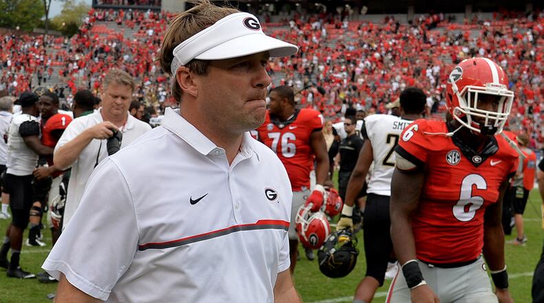Georgia Bulldogs head coach Kirby Smart walks off the field after falling to the Vanderbilt Commodores 17-16 Saturday Oct. 15, 2016, at Sanford Stadium in Athens.