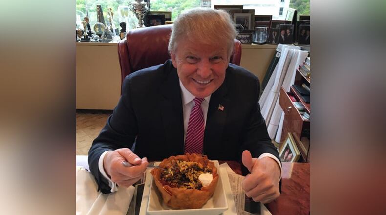 Donald Trump at lunch with a "taco bowl" on May 5, Cinco de Mayo. AJC file