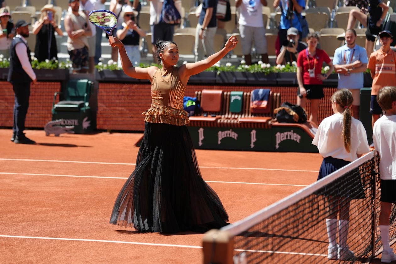 Naomi Osaka of Japan gestures before the first round women's singles tennis match against Laura Siegemund of Germany at the French Open tennis tournament in Paris, Tuesday, May 26, 2026. (AP Photo/Aurelien Morissard)