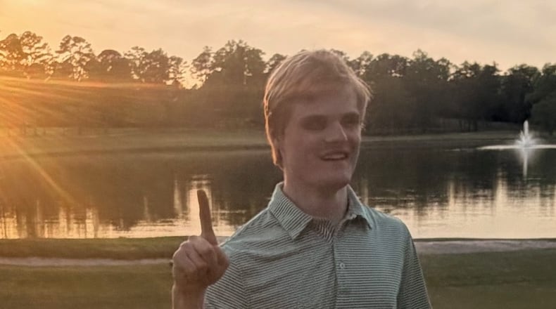 Jack Lenaeus signals he’s No. 1 after learning of his first place finish in the Masters Fantasy game on Sunday, April 12, 2026. A senior at Carrollton High, he prevailed over 682,000 other entries to hit the jackpot. (Courtesy of Laura Lenaeus)