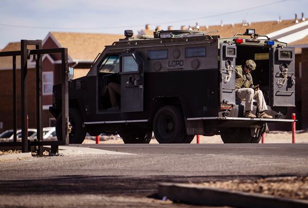 A Las Cruces SWAT vehicle passes by the site of a shooting Young Park in Las Cruces, N.M., on Sunday, March 23, 2024. (Chancey Bush/The Albuquerque Journal via AP)