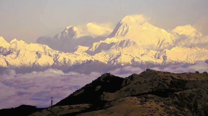 A double amputee from China conquered the summit of Mount Everest on his fifth attempt Monday.