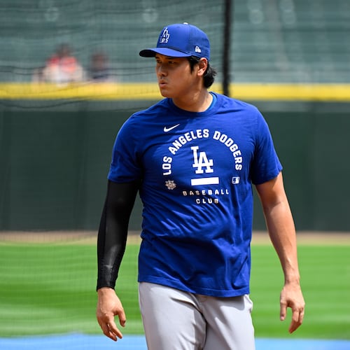 Los Angeles Dodgers two-way player Shohei Ohtani, from Japan, during warmups before a baseball game against the Chicago White Sox, Saturday, June 13, 2026, in Chicago. (AP Photo/Matt Marton)
