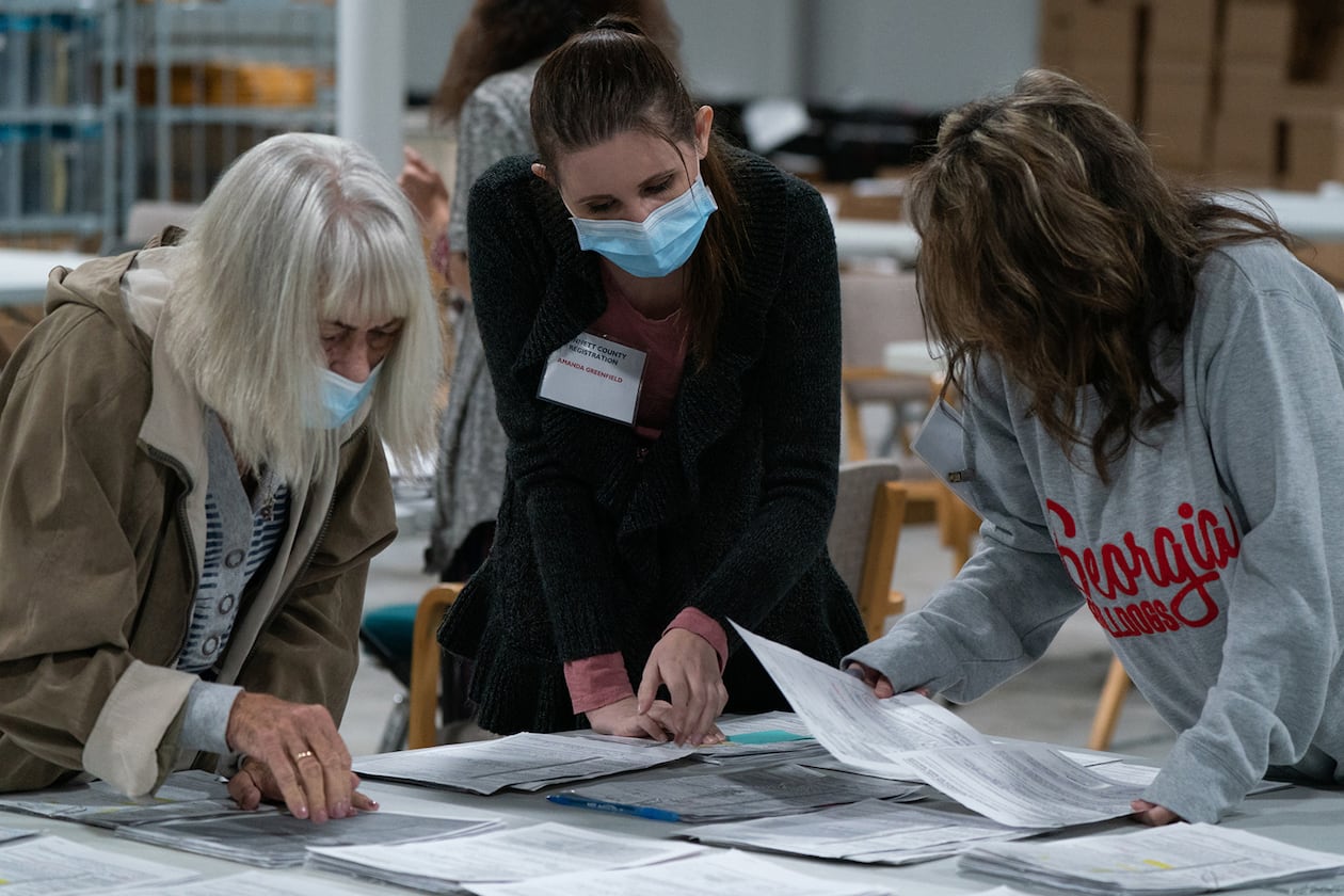 Election personnel sort absentee ballot applications at the Gwinnett County Board of Voter Registrations and Elections offices on Nov. 7, 2020, in Lawrenceville. (Elijah Nouvelage/Getty Images/TNS)