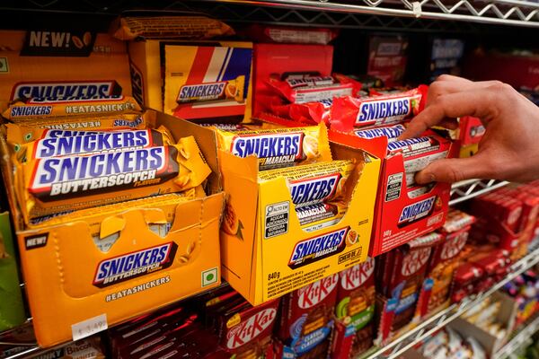 Snickers bars from Brazil are displayed for sale at Economy Candy in New York's Lower East Side, Friday, April 4, 2025. (AP Photo/Richard Drew)