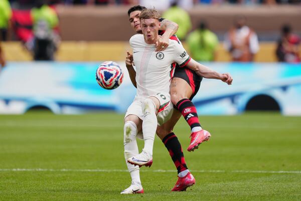 Chelsea's Cole Palmer, front, and Flamengo's Ayrton Lucas fight for the ball during the Club World Cup Group D soccer match between Flamengo and Chelsea in Philadelphia, Friday, June 20, 2025. (AP Photo/Derik Hamilton)
