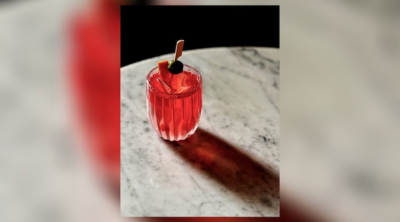 The sun-warmed sweetness of a strawberry is in delicate balance with gin and a touch of olive brine in Kimball House's Salted Strawberry Negroni. (Courtesy of Miles Macquarrie)