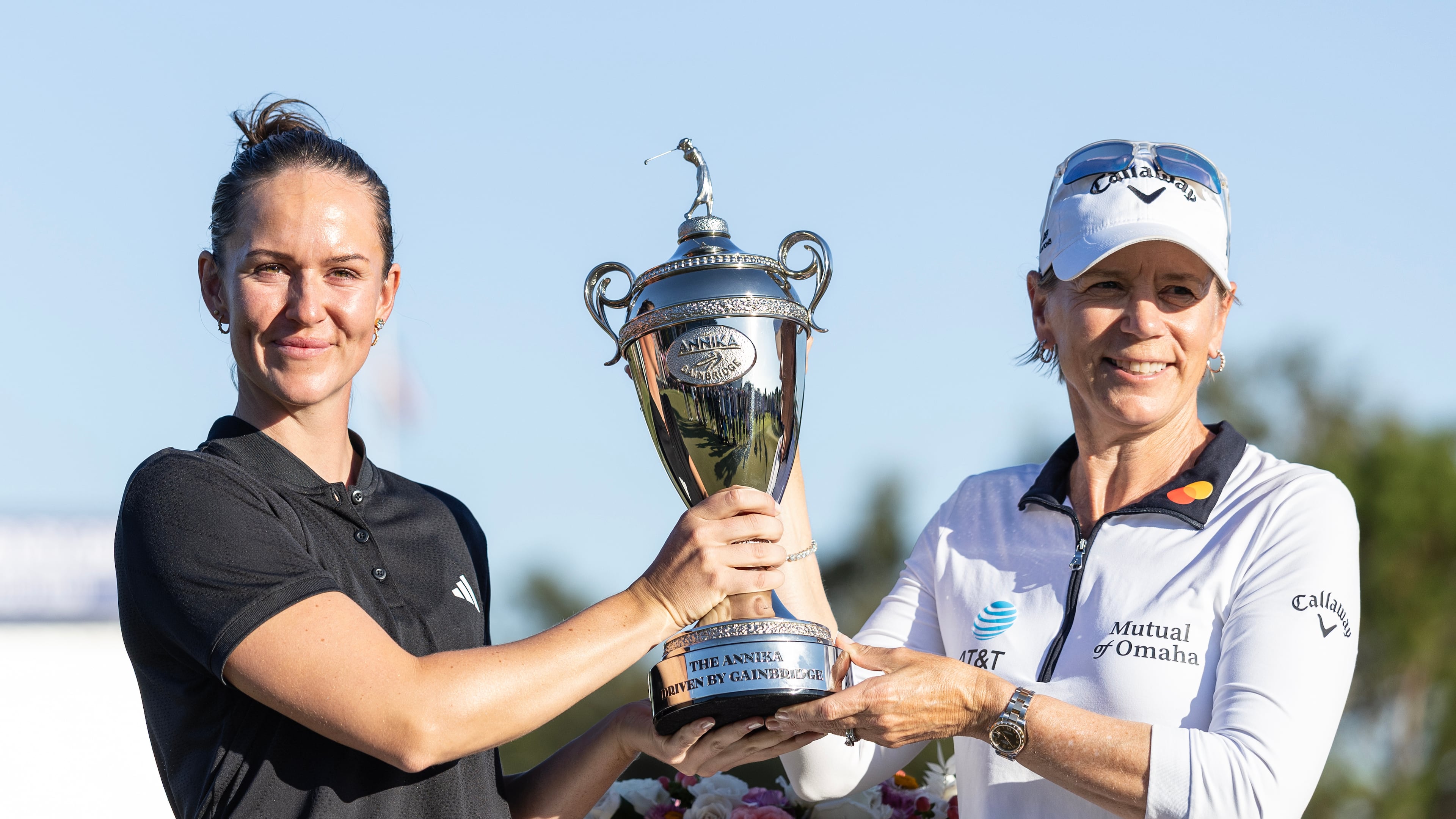 Linn Grant, left, and Annika Sorenstam, right, hold the championship trophy after Grant's win on the final day of The Annika LPGA golf tournament in Belleair, Fla., Sunday, Nov. 16, 2025. (AP Photo/Willie J. Allen Jr.)
