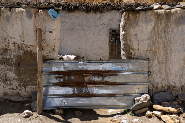 The locked door of a house is seen ain the abandoned village of Samjung, Mustang region, 462 kilometers west of Kathmandu, Nepal, Friday, April 18, 2025. (AP Photo/Niranjan Shrestha)