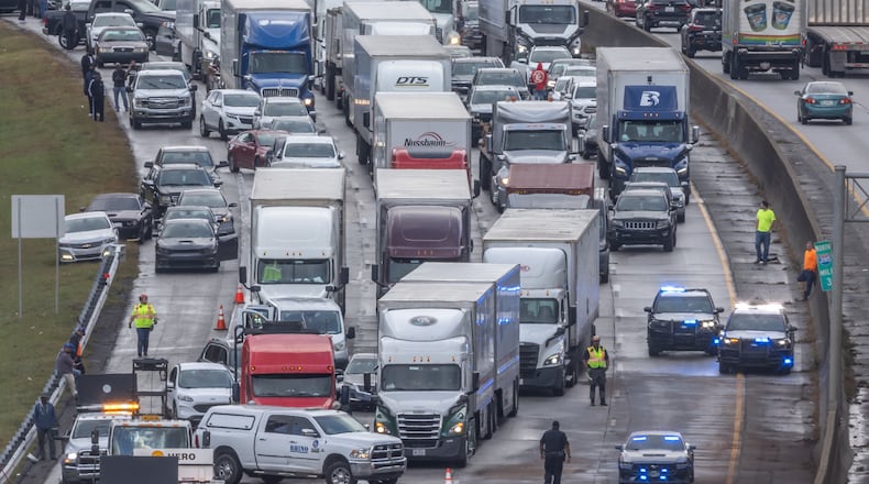 If you are traveling for the Thanksgiving holiday, experts advise packing patience. (John Spink/AJC)