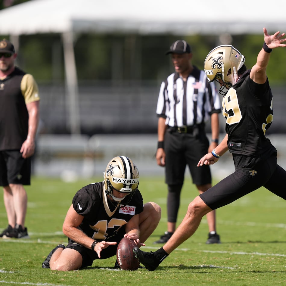 New Orleans Saints place kicker Charlie Smyth and holder Matthew Hayball go through drills during Back Together Weekend at the team's NFL football training camp in Metairie, La., Sunday, July 27, 2025. (Gerald Herbert/AP)