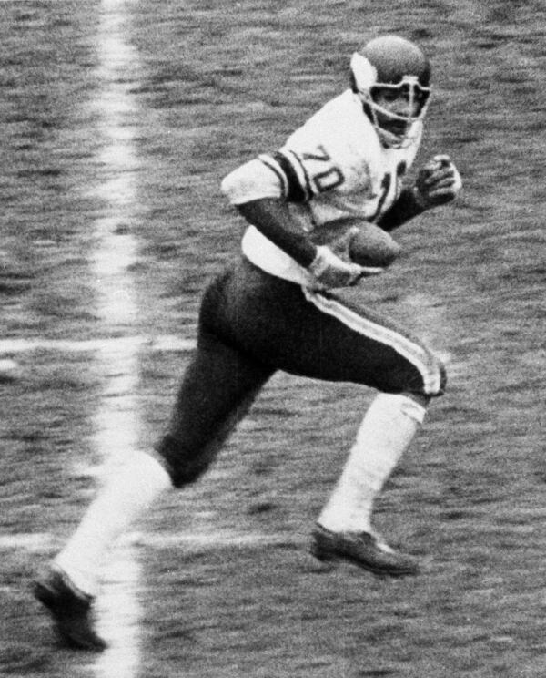 FILE - Minnesota Vikings defensive end Jim Marshall (70) runs 60 yards the wrong way into his own end zone for a safety after scooping up a fumble by the San Francisco 49ers during the fourth quarter of an NFL football game in San Francisco, Calif., Oct. 26, 1964. (San Francisco Examiner via AP, File)