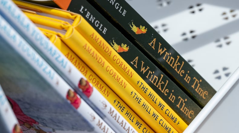 Republican Georgia senators want to influence book availability, seeking to cut off funding for local libraries affiliated with the American Library Association. MoveOn Political Action's Banned Bookmobile distributed free banned books, these titles included, at the kickoff of National Banned Book Week on Sunday, Oct 1, 2023, at libraries at Little Shop of Stories in Decatur Square. (Jenni Girtman for The Atlanta Journal-Constitution)