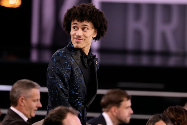 Nolan Traore reacts after being selected 19th by the Brooklyn Nets in the first round of the NBA basketball draft, Wednesday, June 25, 2025, in New York. (AP Photo/Adam Hunger)
