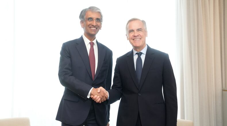 Canada Prime Minister Mark Carney, right, meets Chief Executive Officer of Temasek Holdings Dilhan Pillay in Toronto on Monday, Sept. 14, 2026. (Nathan Denette/The Canadian Press via AP)