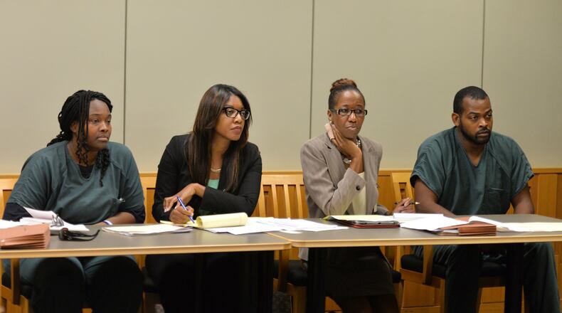 July 10, 2014 Lawrenceville - Recardo (right) and Therian Wimbushat (left) sit with their defense attorneys Otanya Clarke (second from left) and Teri Thompson during a hearing before Gwinnett chief magistrate Christina Blum at Gwinnett Magistrate Court in Lawrenceville on Thursday, July 10, 2014. Bond has been denied for Recardo and Therian Wimbush being held on child cruelty charges that they kept their oldest child a prisoner in their home. HYOSUB SHIN / HSHIN@AJC.COM