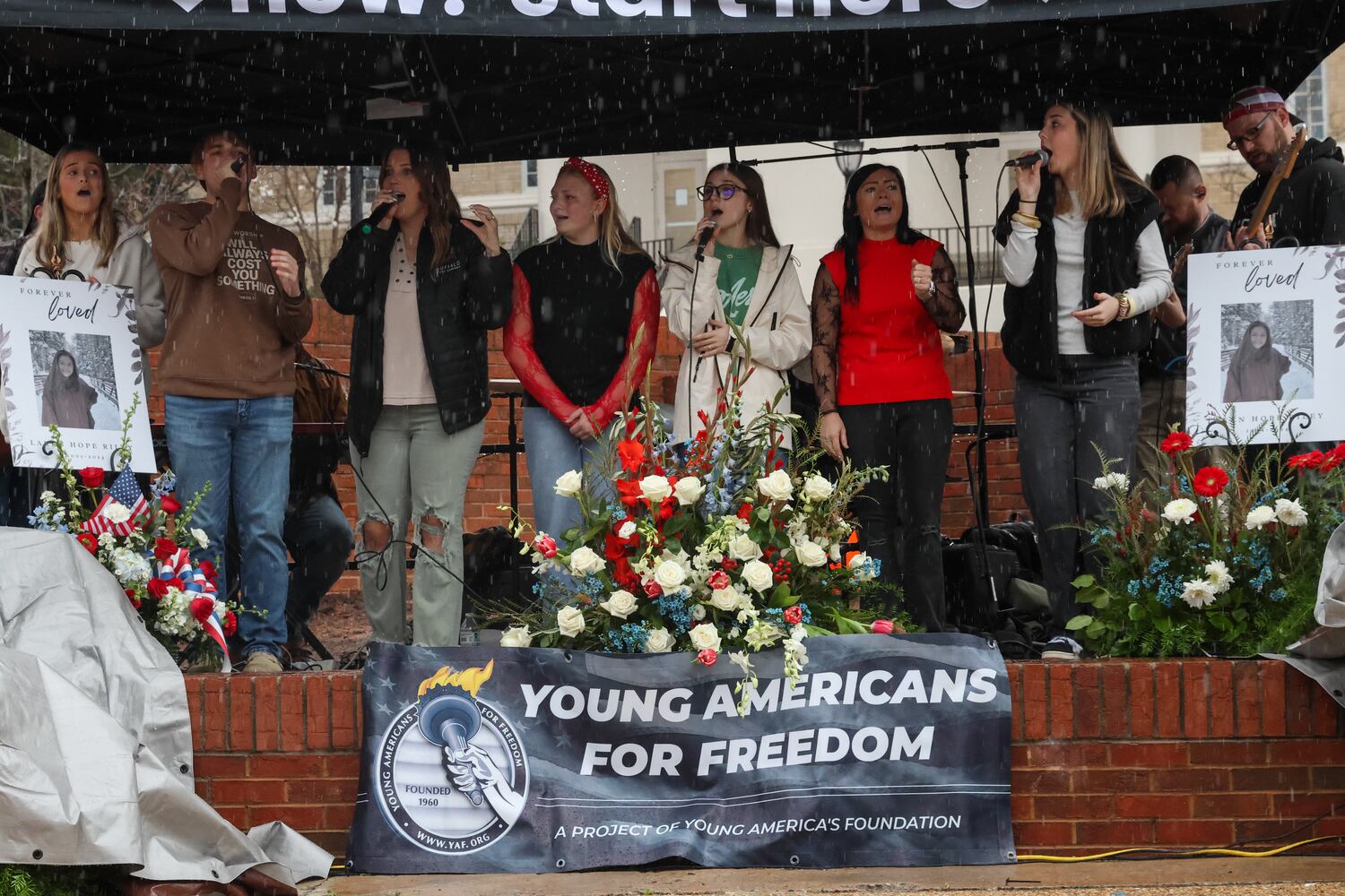 Singers and musicians from NewGrace Church in Commerce, Ga., perform at UGA’s Tate Plaza on Saturday, Feb. 21, 2026, at a memorial service for Augusta University nursing student Laken Riley. Riley was attacked on Feb. 22, 2024 while running in Oconee Forest Park on the UGA campus and killed. Riley had previously attended UGA.
(C.J. Bartunek for the AJC)
