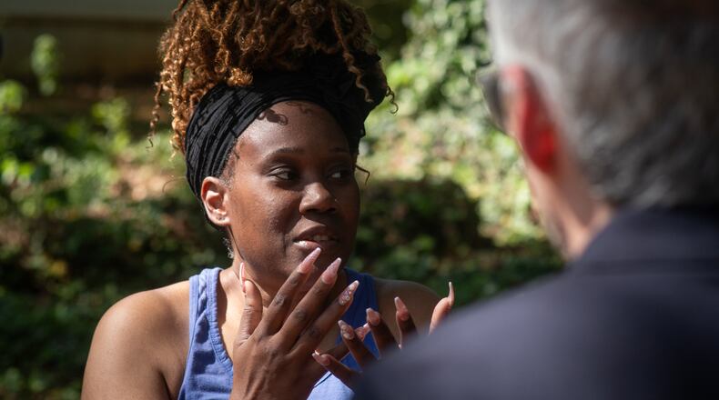 Lakisha Mckinzie discusses her ex-housemate, Olaolukitan Adon Abel, who is charged in a string of deadly shootings, in Decatur, Ga., on Friday, April 17, 2026. (AP Photo/Ron Harris)