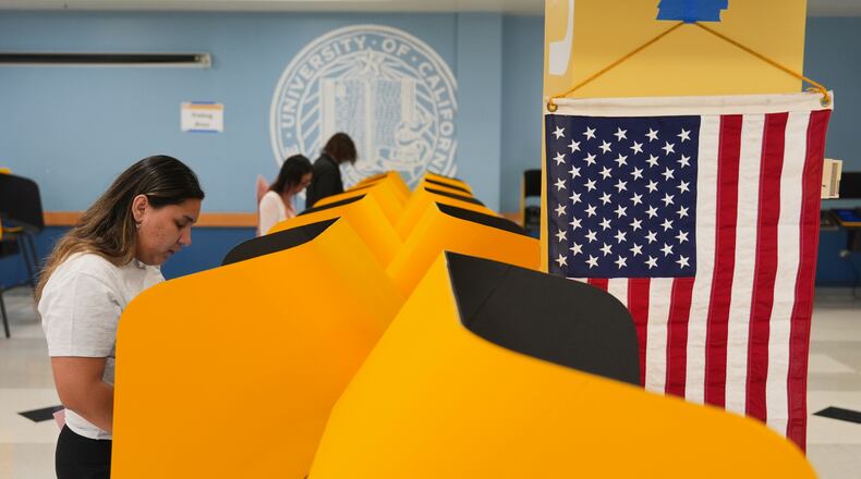 FILE - Voters cast their ballots at a voting center on the UCLA campus, June 2, 2026, in Los Angeles. (AP Photo/Jae C. Hong, File)