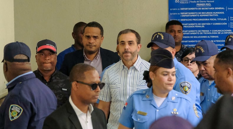 FILE - Antonio Espaillat, center, the owner of the Jet Set nightclub, whose roof collapse in 2025 resulted in fatalities, arrives at court for trial in Santo Domingo, Dominican Republic, April 27, 2026. (AP Photo/Ricardo Hernandez, File)