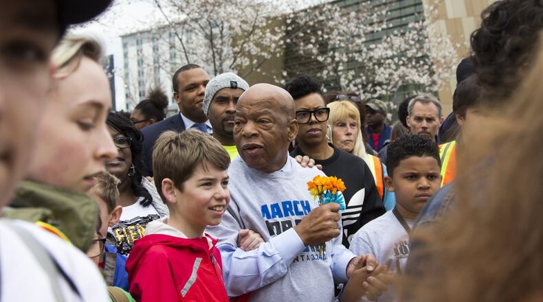 Congressman John Lewis marches with students during the March for our Lives event in Atlanta, Georgia, on Saturday, March 24, 2018. (REANN HUBER/REANN.HUBER@AJC.COM)