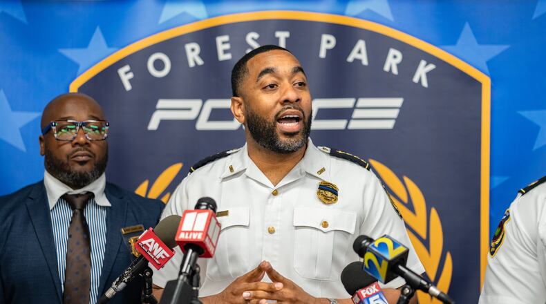 Forest Park police Chief Brandon Criss gives an update on a Sunday night double fatal shooting that happened on First Street. (Ben Hendren for the AJC)