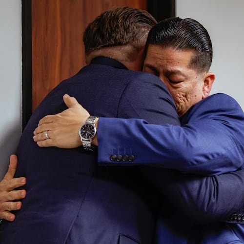 Former Uvalde school district police officer Adrian Gonzales, right, embraces his attorney Jason Goss after the jury found Gonzales not guilty at the Nueces County Courthouse on Wednesday, Jan. 21, 2026, in Corpus Christi, Texas. (Sam Owens/The San Antonio Express-News via AP, Pool)