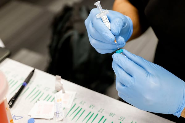 A nurse prepares a dose of the measles, mumps and rubella virus vaccine at a pop-up clinic at the Carrollton-Farmers Branch ISD Administration Building in Carrollton, Texas, on March 7, 2025. (Liz Rymarev/The Dallas Morning News/TNS)