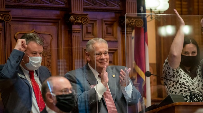 06/26/2020 - Atlanta, Georgia - Georgia Speaker of the House David Ralston (R-Blue Ridge), center, congratulates members of the House after they passed HB 793 on Sine Die, day 40, of the legislative session in Atlanta, Friday, June 26, 2020. (ALYSSA POINTER / ALYSSA.POINTER@AJC.COM)