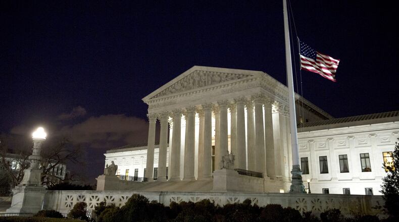 The American flag flies at half mast at the U.S. Supreme Court February 13, 2016 in Washington, DC. Supreme Court Justice Antonin Scalia was at a Texas Ranch Saturday morning when he died at the age of 79. (Photo by Drew Angerer/Getty Images)
