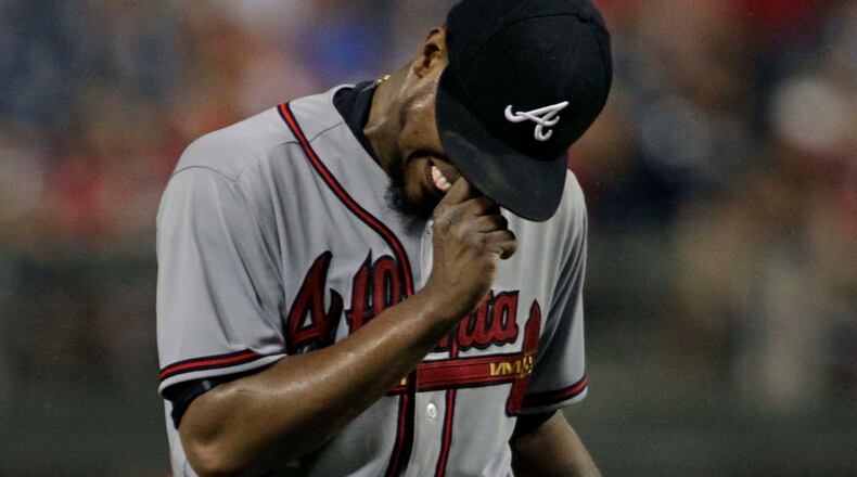 Braves pitcher Julio Teheran reacts after Philadelphia Phillies’ Tommy Joseph hit a three-run home run during the fifth inning on Friday, July 28, 2017, in Philadelphia. (AP Photo/Tom Mihalek)