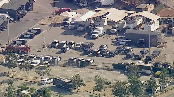 Police and emergency vehicles are in place at the scene of a blast at the Biscailuz Center Training Academy in East Los Angeles on Friday, July 18, 2025. (KABC-TV via AP)