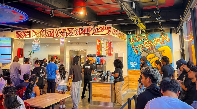 The Atlanta-themed dining room at Dave's Hot Chicken in Conyers was packed early on a Sunday evening. (Henri Hollis/henri.hollis@ajc.com)