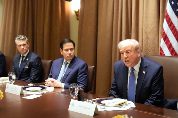 FILE - President Donald Trump, from right, speaks as as Secretary of State Marco Rubio and Secretary of Defense Pete Hegseth listen during a bilateral luncheon in the Cabinet Room of the White House, April 24, 2025, in Washington. (AP Photo/Mark Schiefelbein, File)